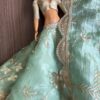 Green and gold embroidered bridal lehenga for Barbie doll