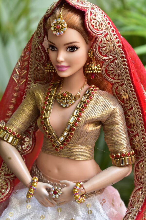 White and red Gujarati bridal lehenga for curvy Barbie doll