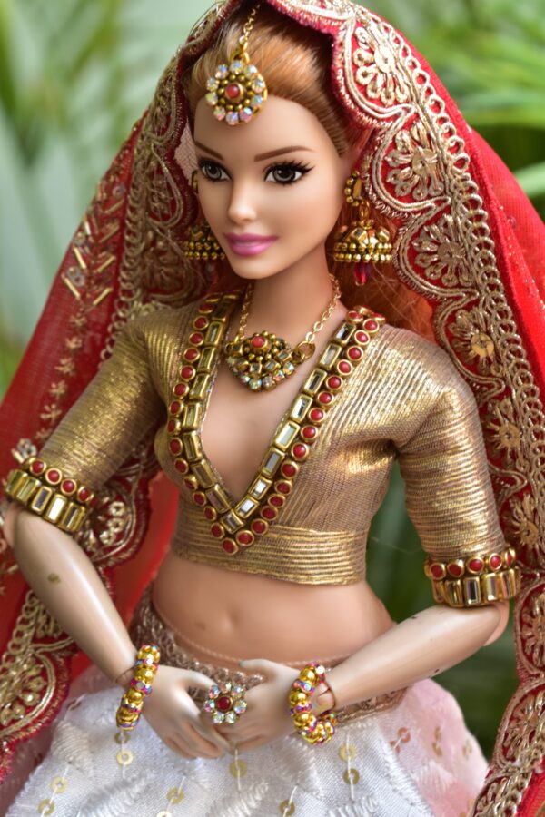 White and red Gujarati bridal lehenga for curvy Barbie doll