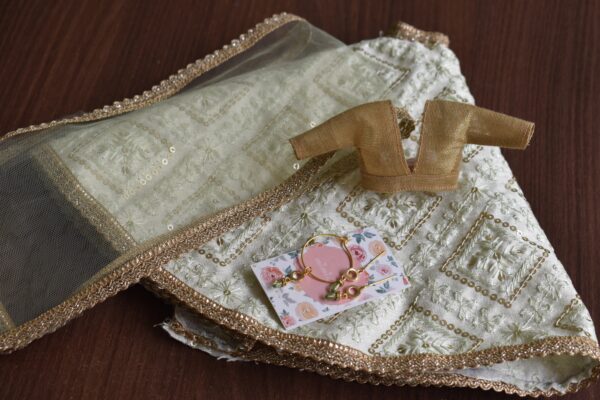 Embroidered pastel green lehenga for doll