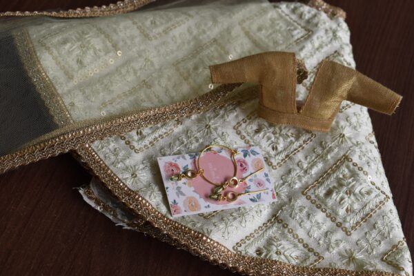 Embroidered pastel green lehenga for doll