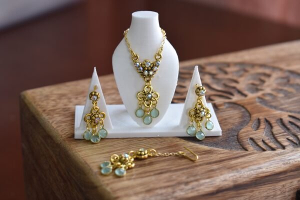 Gold and teal bridal jewelry for dolls